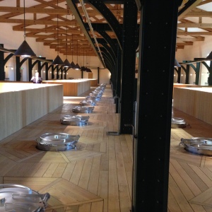 Upper floor of winery, with tops of the stainless steel vats protruding